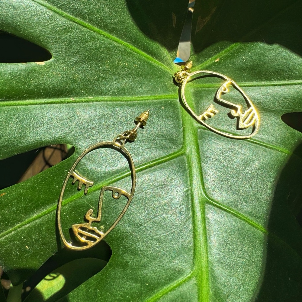 face dangly earrings